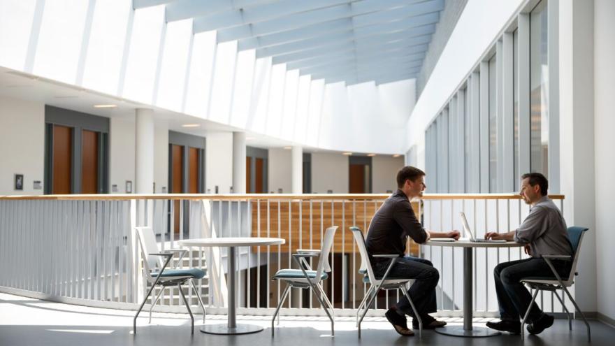 Two researchers in a meeting