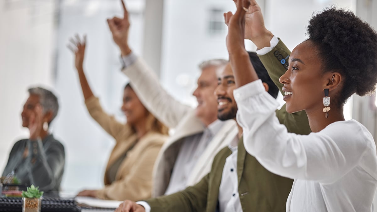 staff members raising hands