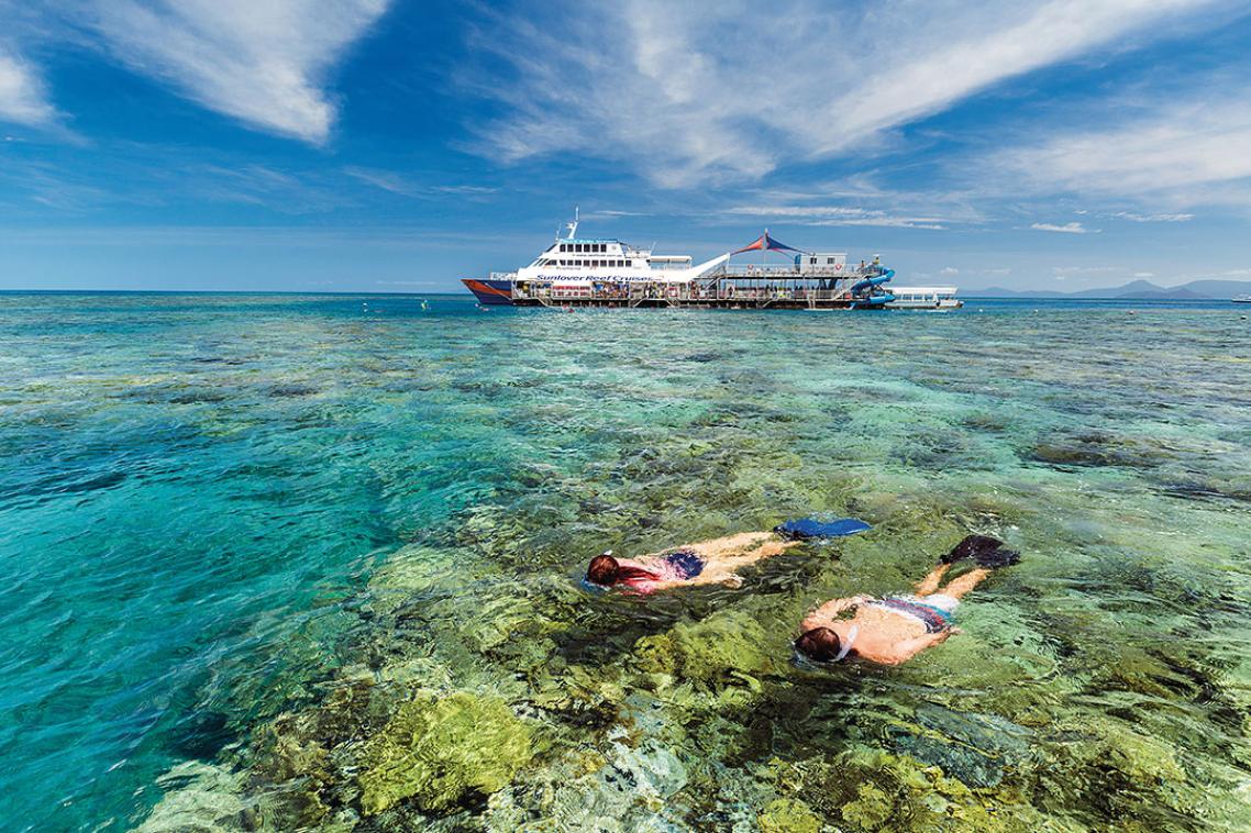 Two people snorkelling on the Great Barrier Reef. Image credit: Tourism and Events Queensland