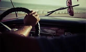 Hands on steering wheel.