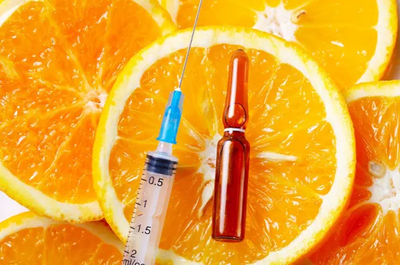 Oranges, syringe and ampule.