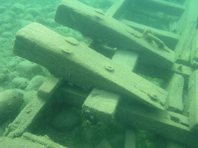 a pile of wood planks underwater