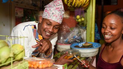 A customer pays for goods and services through mobile money transfer in Kenya.