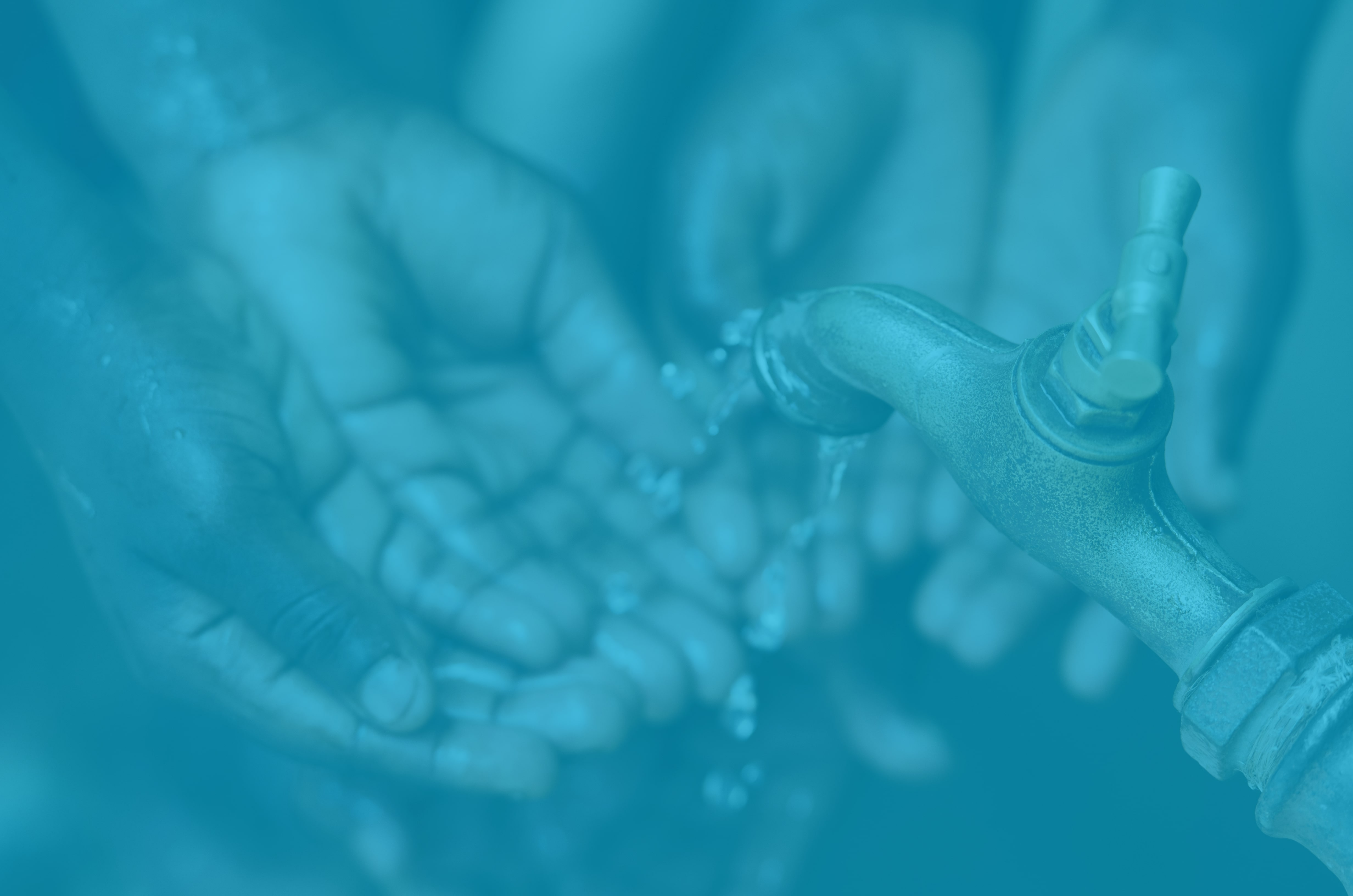 Young hands washing themselves under a water tap