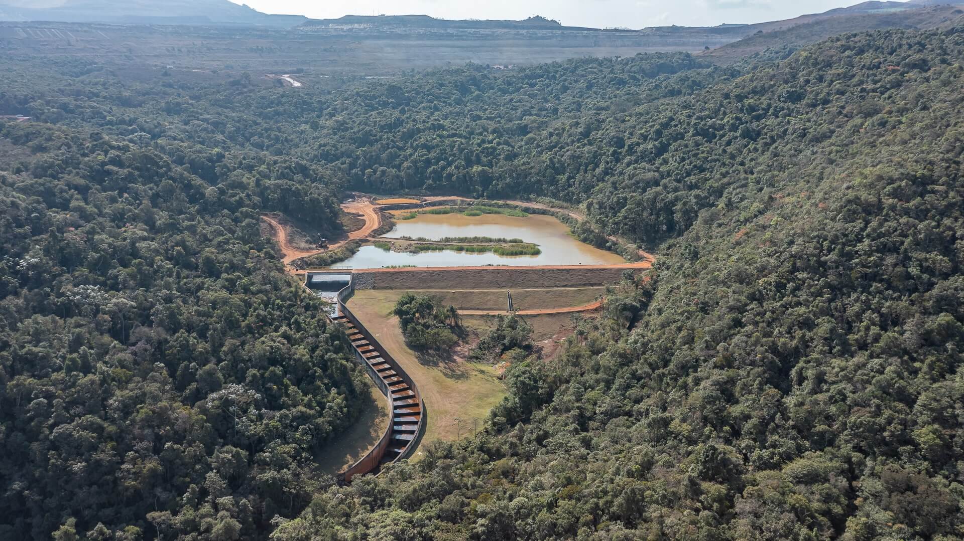 Mountainous, tree-covered region with a lake in the center