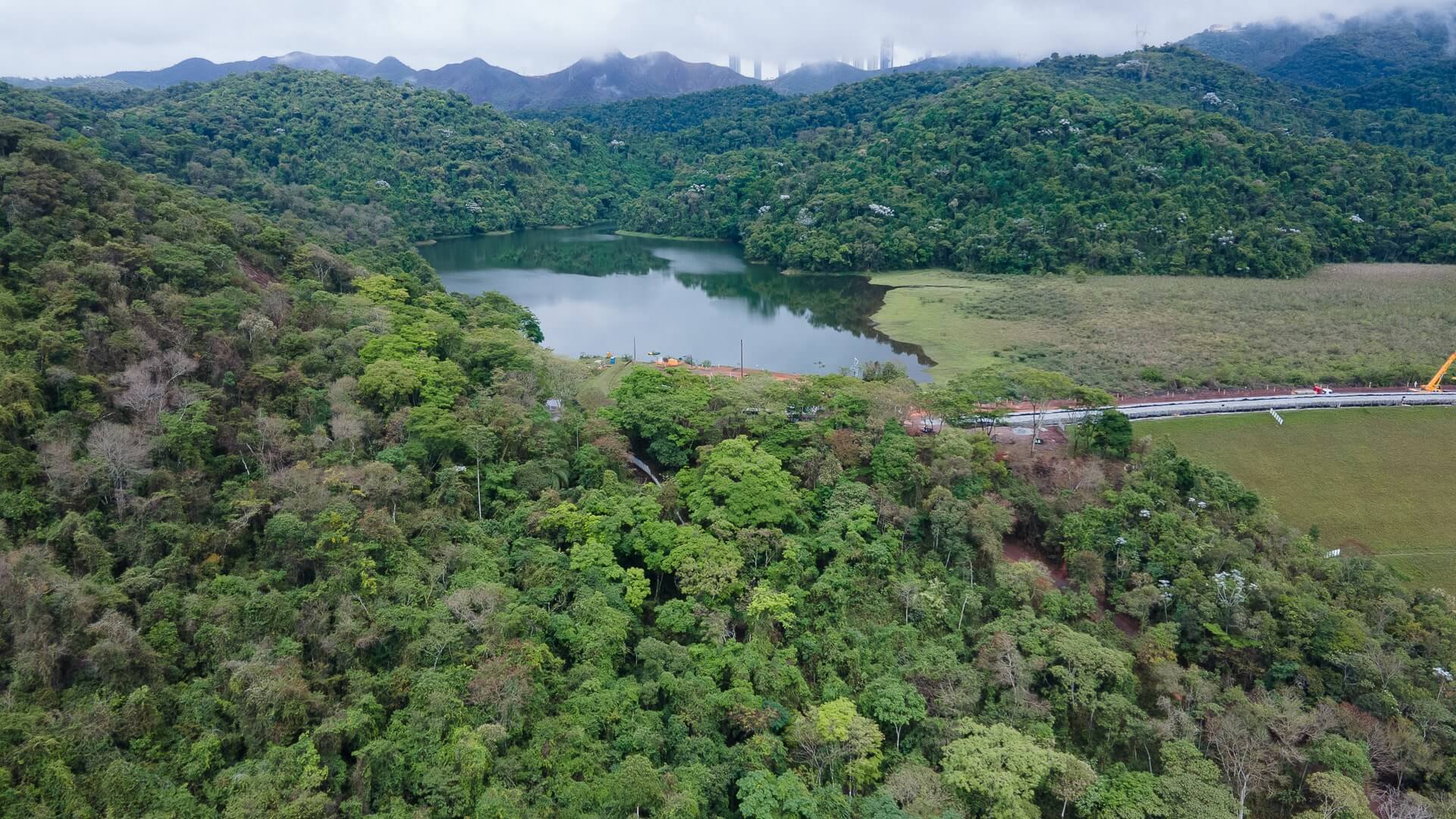 River surrounded by mountains covered in trees