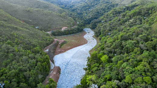 River crossing a tree-covered mountain