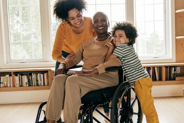 women in wheelchair two children