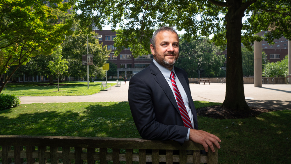 Justin Reich outside with MIT Medical in background