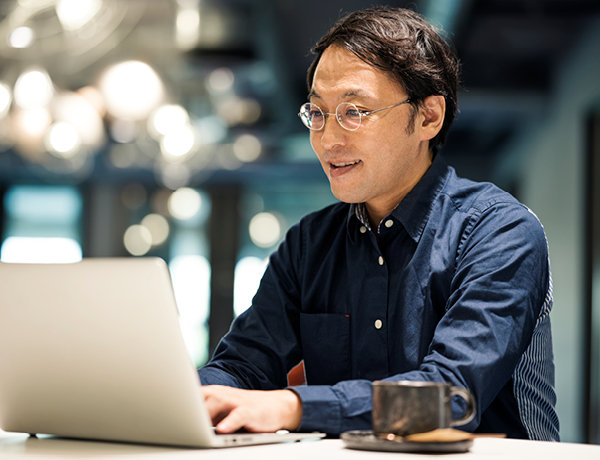 apanese businessman typing email by a laptop learning more about bpo payments