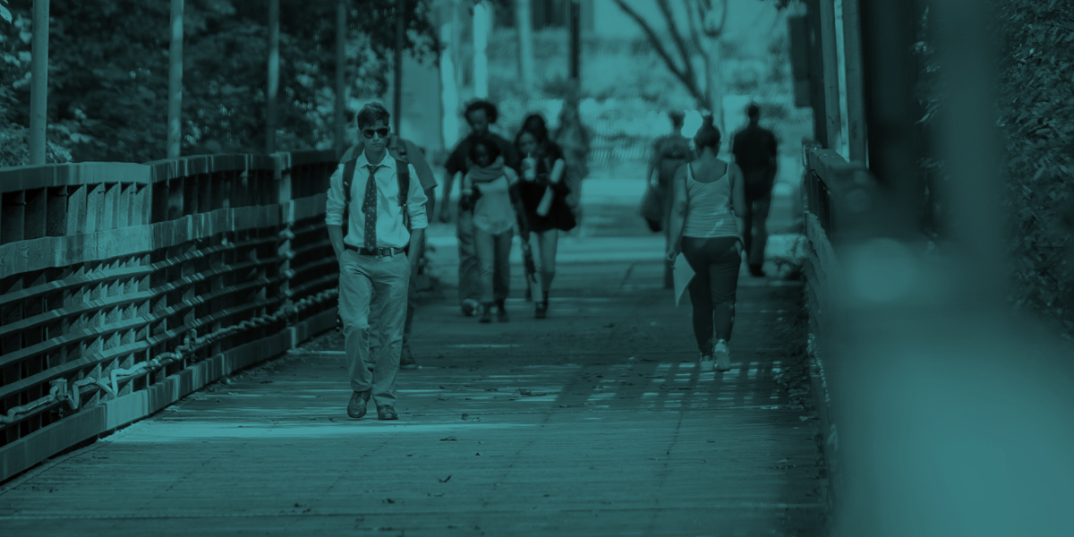 Students walking across the AACC campus.