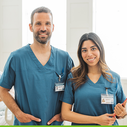 two EVS technicians smiling