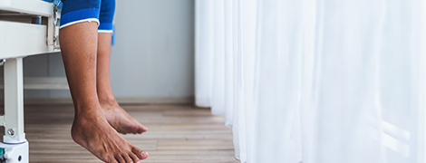 image of a patient's legs waiting to see a doctor