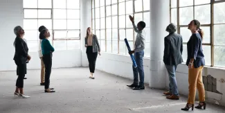 Group of people looking at the ceiling