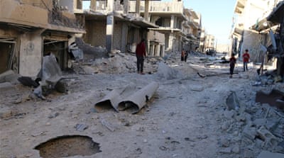 People inspect a damaged site after air strikes on a rebel-held neighbourhood of Aleppo, Syria [Reuters]