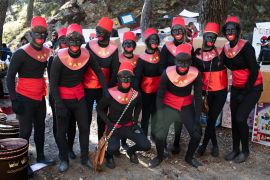 Blackface Pageboys and girls pose at the Magic Kings Camp