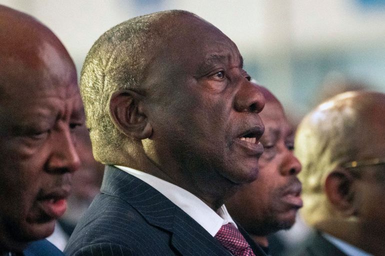 South African President Cyril Ramaphosa sings the national anthem at the formal announcement of the results in South Africa's general elections at the National Results Operations Center in Johannesburg, South Africa, Sunday, June 2, 2024. Humbled by a stinging election result, South Africa's African National Congress was talking to everyone in an effort to form a stable coalition government for Africa's most advanced economy after it lost its 30-year majority. (AP Photo/Jerome Delay)