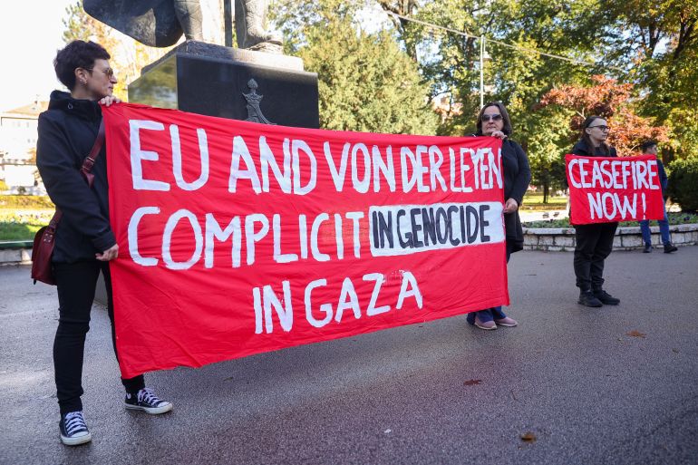 Activists hold a banner against the Israeli airstrikes on Gaza as they gather across from the Bosnian Presidency building during the meeting of European Commission President Ursula von der Leyen with the members of the Bosnian Presidency in Sarajevo, Bosnia, Wednesday, Nov. 1, 2023. (AP Photo/Armin Durgut)