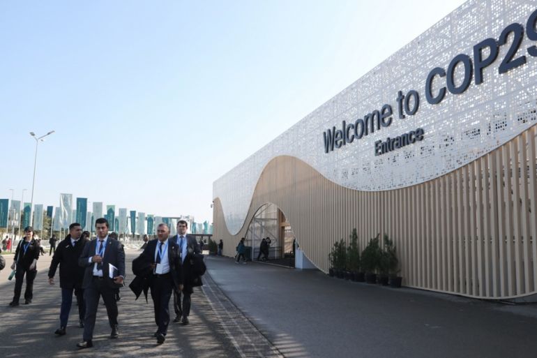 Participants arrive to attend the UN Climate Change Conference COP29 in Baku, Azerbaijan