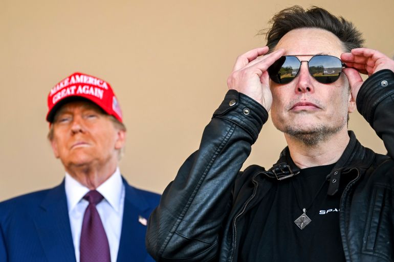 Elon Musk in sunglasses and Donald Trump in a MAGA hat