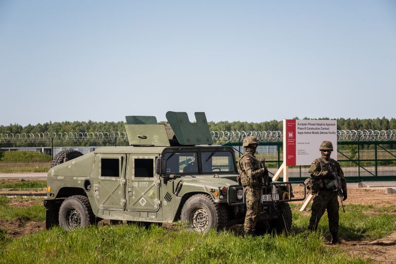 Soldiers stand guard during ground breaking ceremony of the northern section of defence anti-missile shield in Redzikowo military base in northern Poland