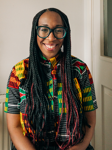 Photo portrait of Shirleena, with a big smile, looking at the reader.