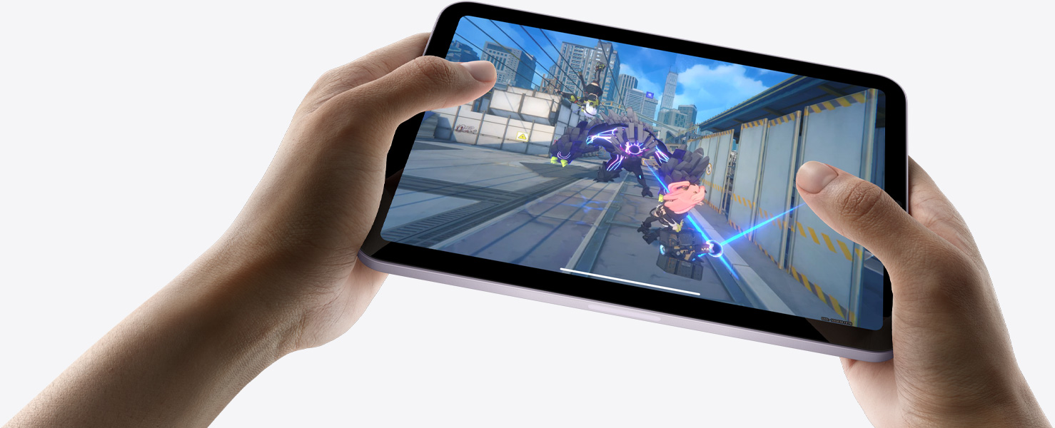 iPad mini held by a user’s hands in landscape view playing a graphically intense game.