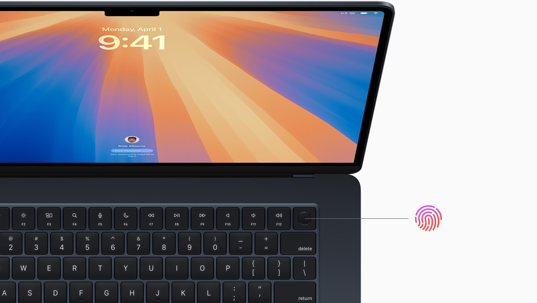 Otwarty MacBook Pro w kolorze gwiezdnej czerni ze wskazanym położeniem przycisku Touch ID.