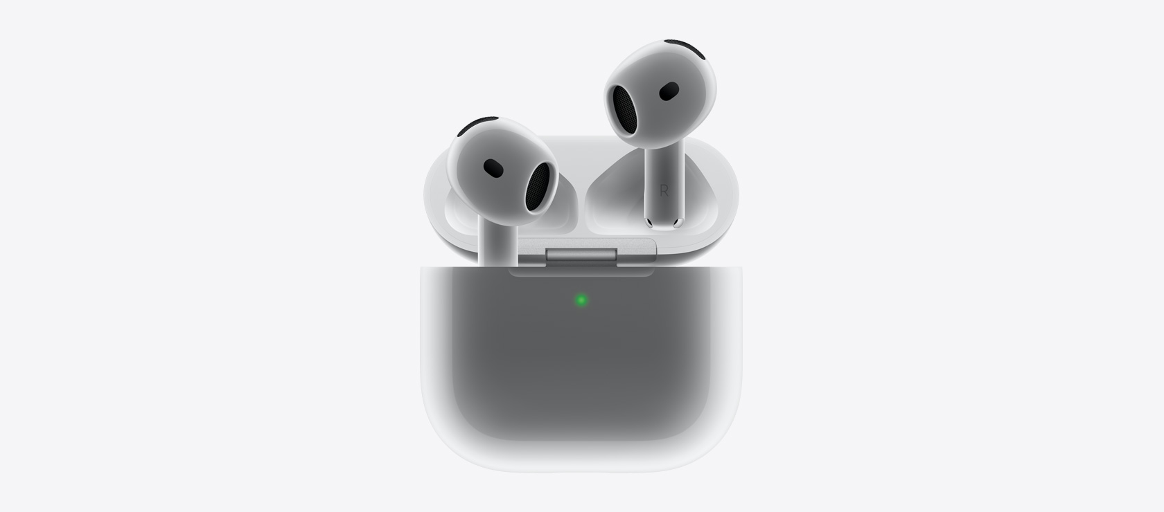 AirPods 4 așezate în carcasa de încărcare.