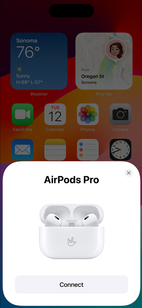 MagSafe Charging Case holding AirPods Pro next to iPhone. Small tile on iPhone home screen displays pop-up with connect button that easily pairs AirPods when tapped.