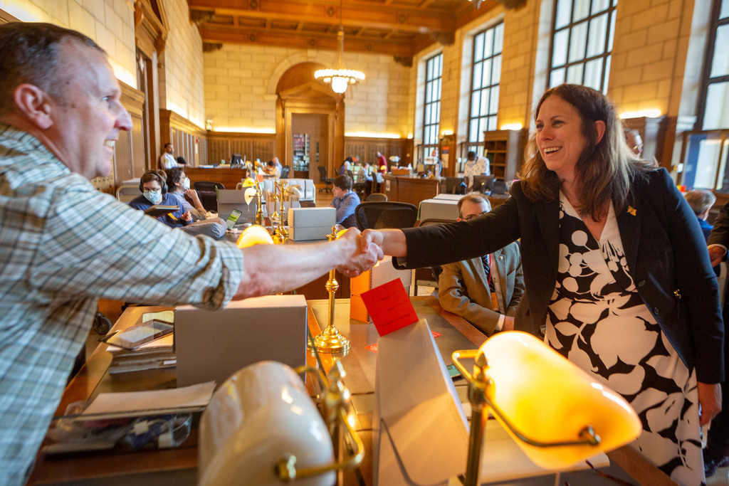 Colleen Shogan greets a researcher on her first day at the National Archives Buildilng