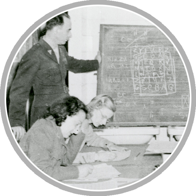 Cryptographers, both male and female, are trained to decode German encrypted communications during World War II. (National Archives, RG 457)