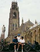 Cyclists in front of St Botolph's Church, Boston, England 