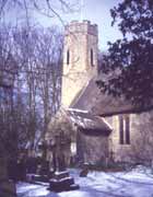 Church and churchyard of All Saints, Horsey, Norfolk covered with snow