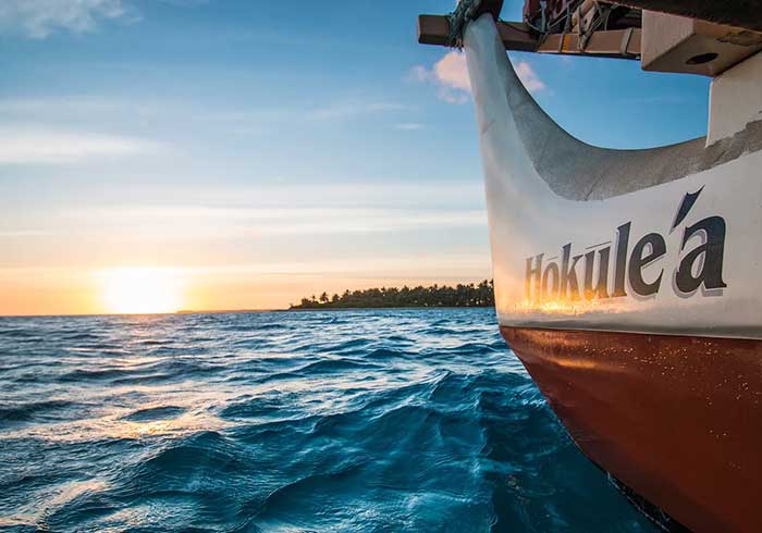 The name Hōkūle‘a painted on the hull of the Polynesian double-hulled sailing canoe