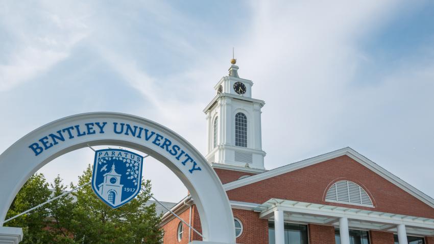 Exterior campus shot of Bentley University arch