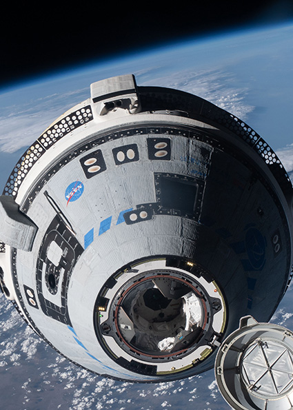 The CST-100 Starliner autonomously approaches the International Space Station during the uncrewed Orbital Flight Test-2 in May 2022.