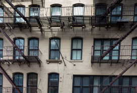 In Manhattan, a glimpse at a New York city residential building, with its famous exterior fire escape staircase.