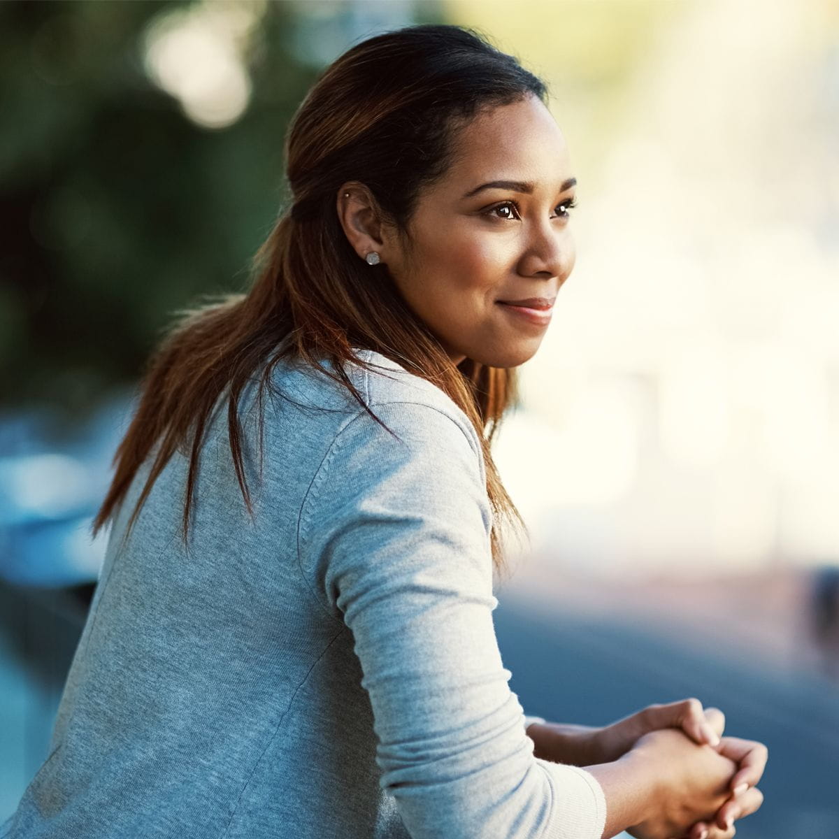 woman smiling and thinking