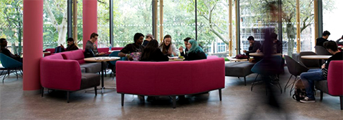 Students sitting in the entrance lounge area of the Bill Brown Suite