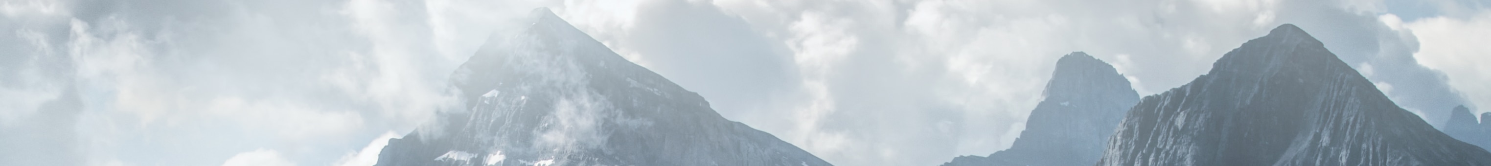 Landscape shot of a foggy mountain