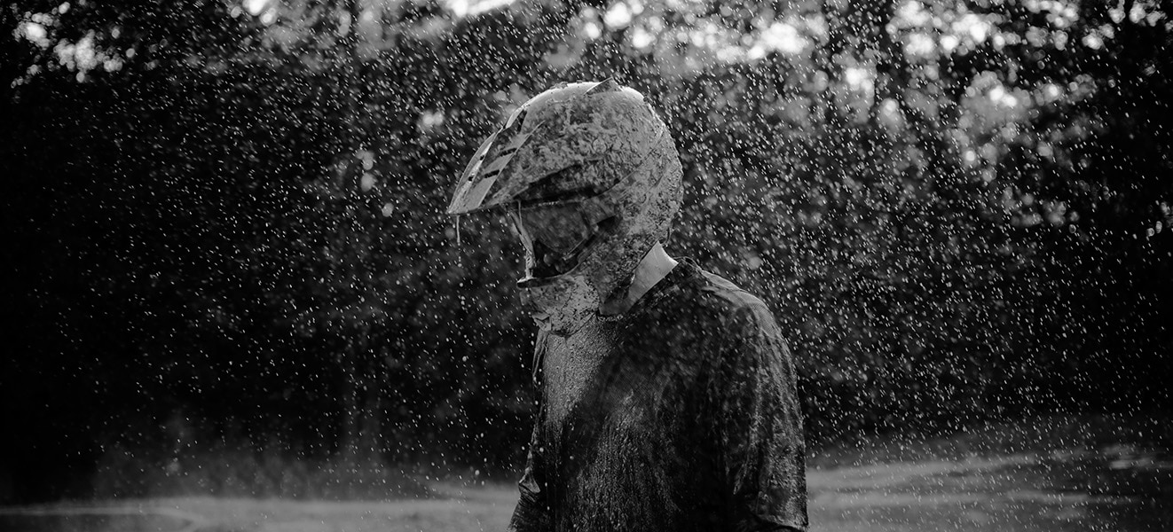 Rider standing in the rain