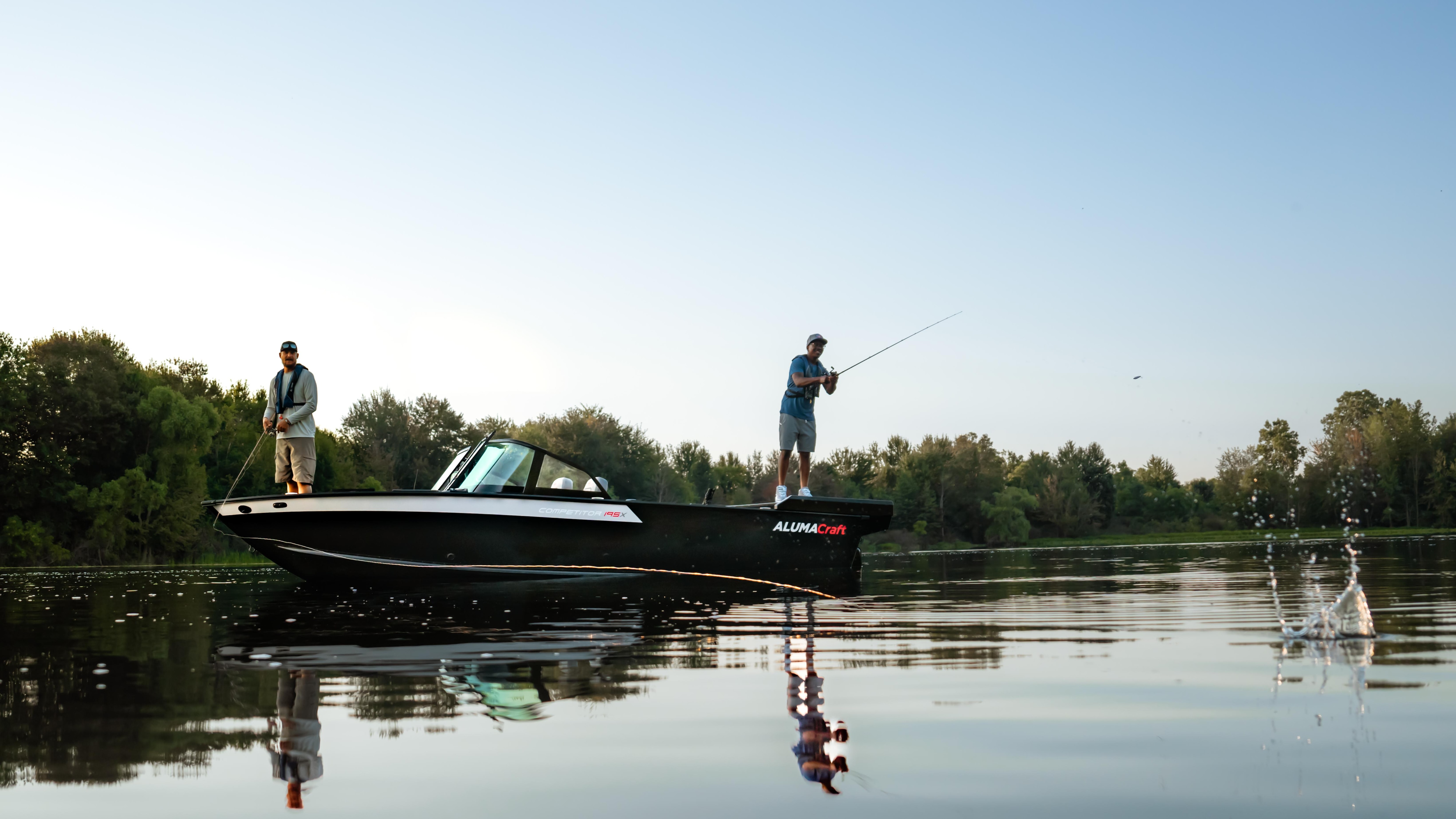 Two fishermen fishing from an Alumacraft aluminum boat