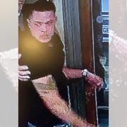 CCTV released of a man police would like to speak to after a window was punched and smashed in Beaconsfield