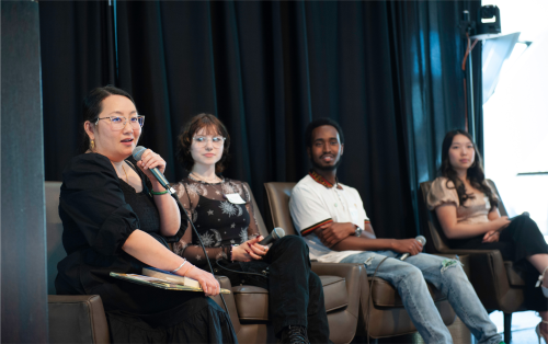 Students speaking on stage at the Student-Centered Learning for Equity Conference.