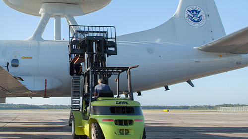 Cargo being loaded into an airplane.