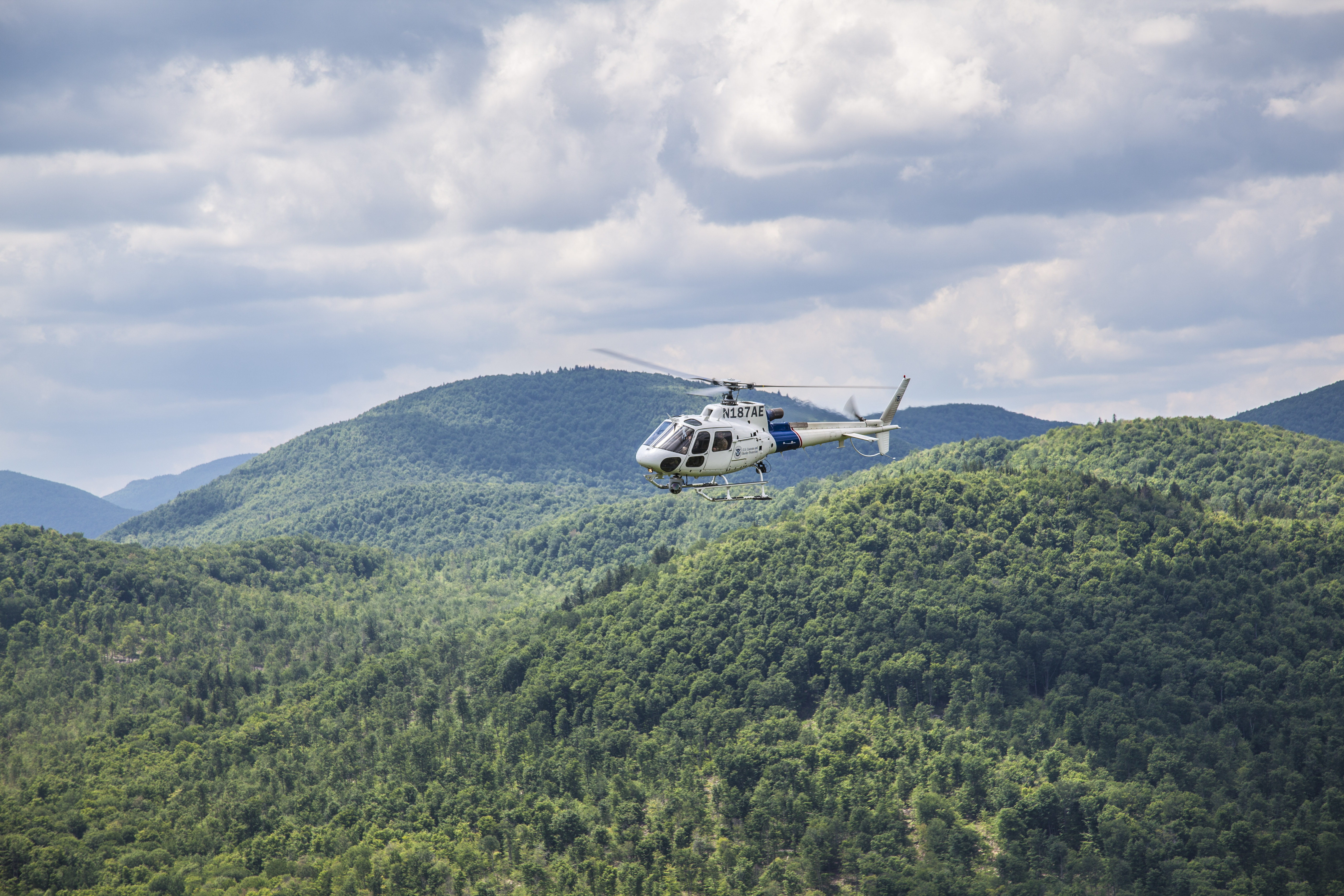 An AS350 crew assists in the hunt for escaped prisoners Richard Matt and David Sweat in upstate in NY.