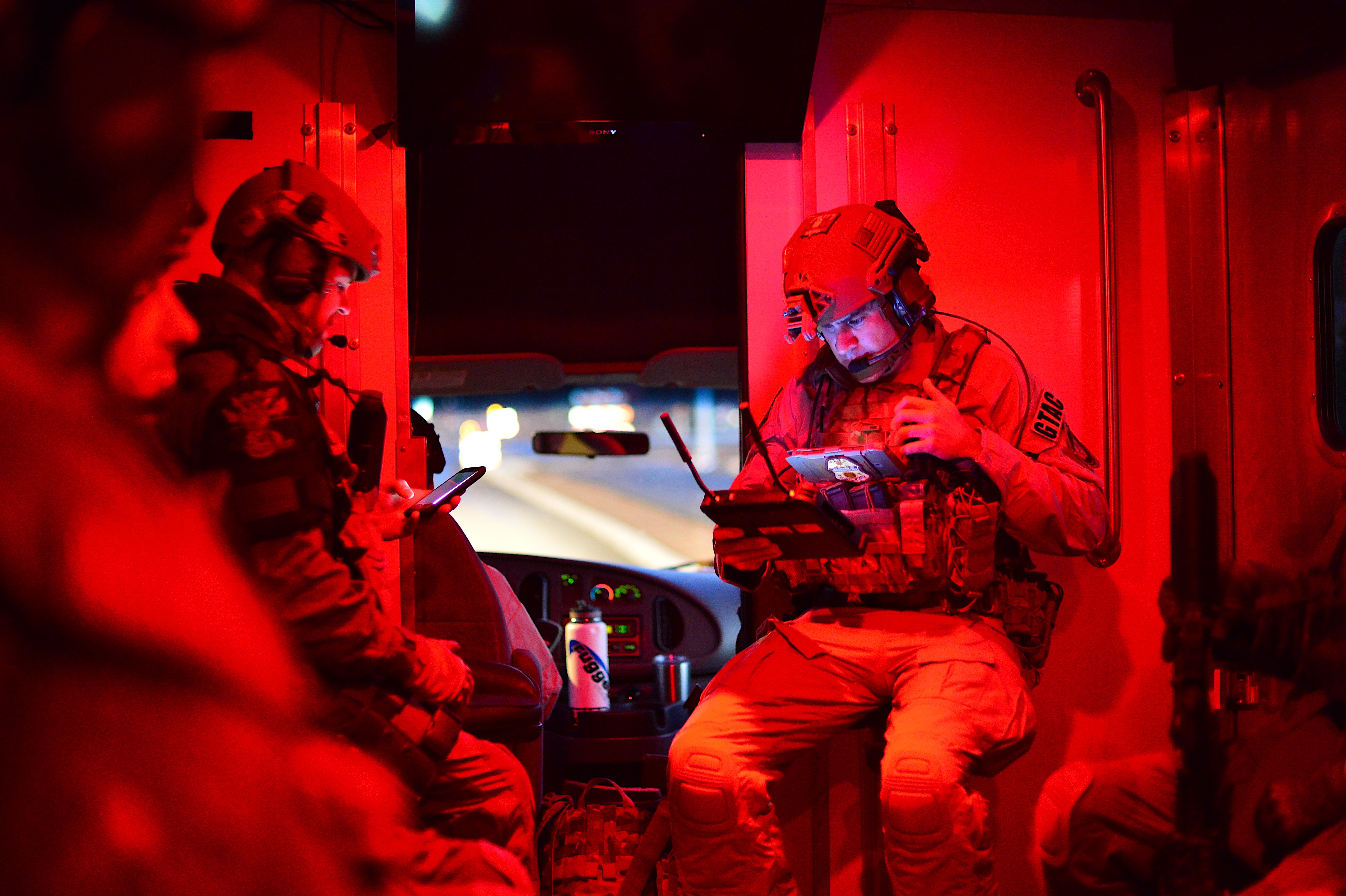 An AMO Ground Team Air Coordinator preparing for the execution of numerous search and arrest warrants in southern Arizona that dismantled a local drug trafficking organization suspected of distributing and selling heroin, marijuana, and various firearms.