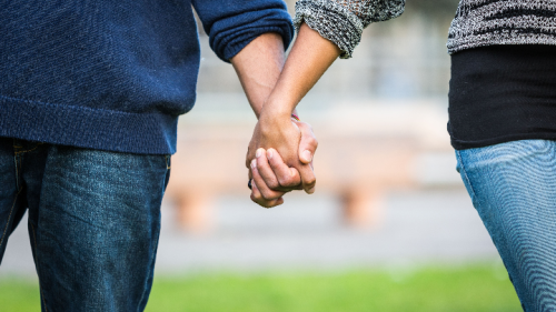 Couple holding hands