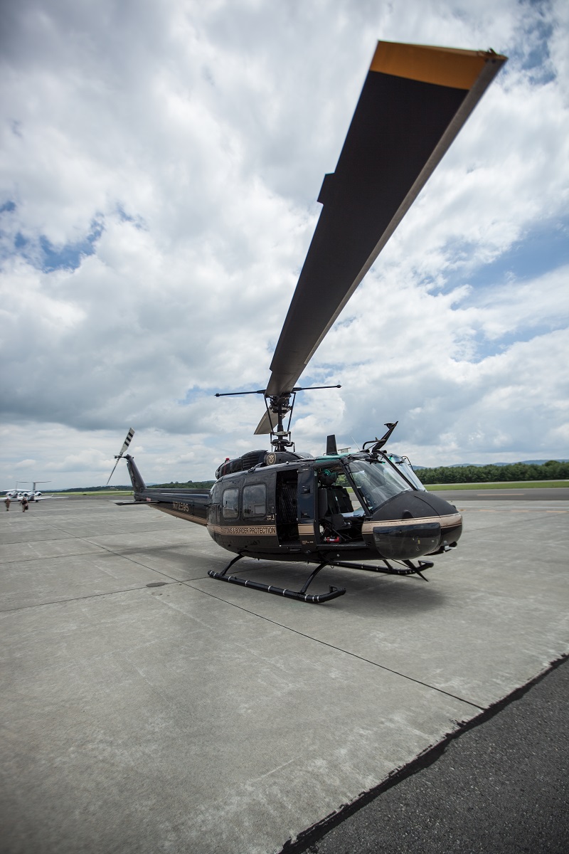 A CBP Bell Huey II readies for takeoff. (photo by Josh Denmark)